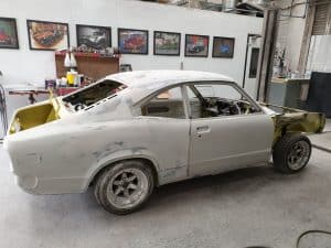 repainting process of yellow Mazda RX3