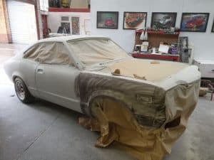 repainting yellow an Mazda RX3