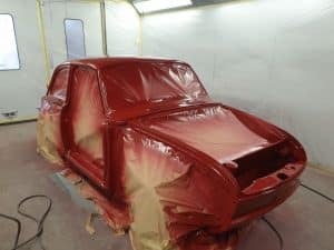 red Volkswagen Notchback repainting process